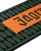 Close up of green and orange mat with Jägermeister logo 