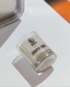 Jägermeister candle on a white surface