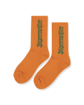 Orange socks with green Jägermeister wordmark.