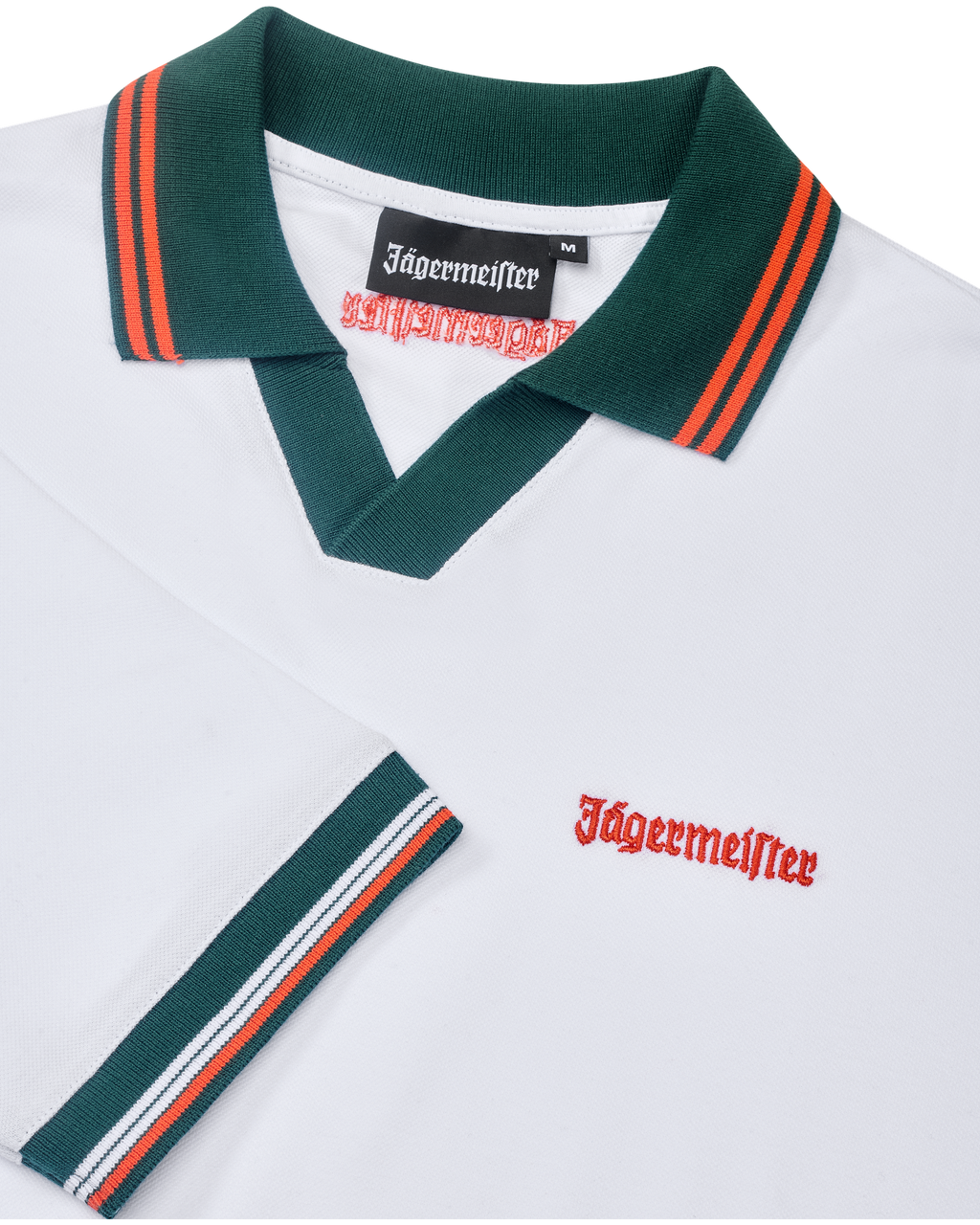 White Jägermeister polo shirt with green collar and orange trim featuring orange Jägermeister branding.
