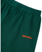 Green shorts with orange Jägermeister logo.